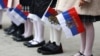 Russia -- Pupils hold the Russian flags during a Knowledge Day ceremony