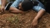 SRI LANKA -- A Sri Lankan woman cries during a burial service for a bomb blast victim in a cemetery in Colombo, April 23, 2019