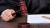 GENERIC – Cropped image of judge giving verdict by hitting mallet at desk