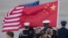 U.S. -- The flags of China and the United States are flown before the arrival of President of China Xi Jinping (not pictured) at Joint Base Andrews, Maryland, outside Washington DC, USA, 30 March 2016.